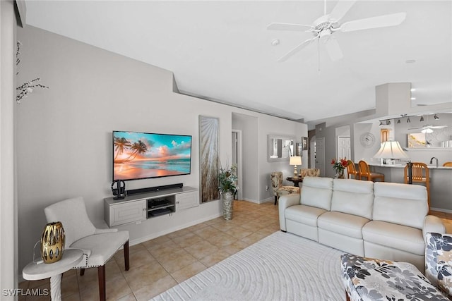 living room with ceiling fan and light tile patterned floors