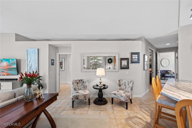 living room with light tile patterned floors