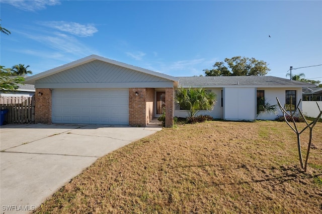 single story home with a front yard and a garage