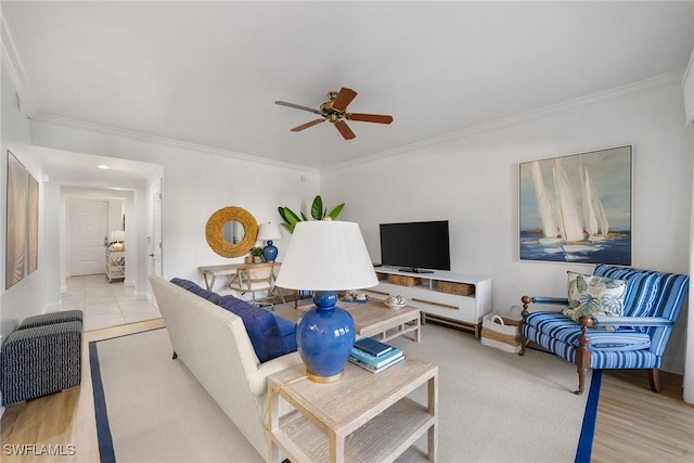 living room featuring ceiling fan and ornamental molding