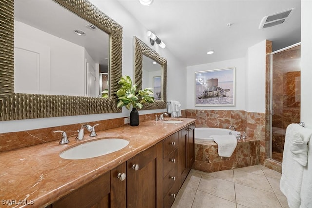 bathroom with tile patterned flooring, vanity, and shower with separate bathtub