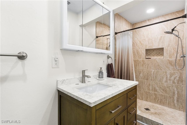 bathroom with vanity and a shower with shower curtain