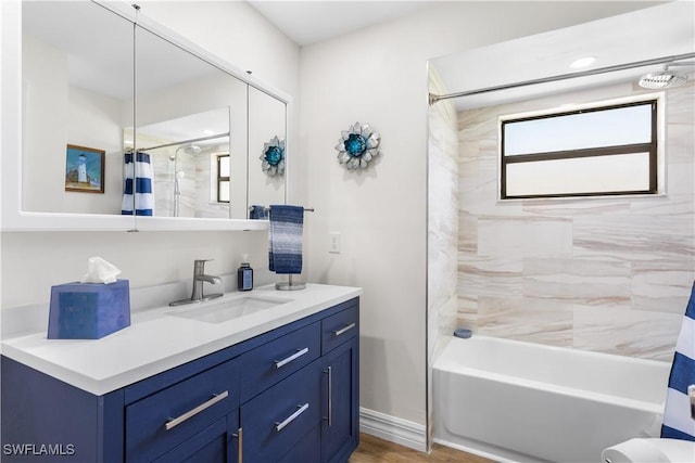 bathroom featuring shower / tub combo, vanity, and hardwood / wood-style flooring