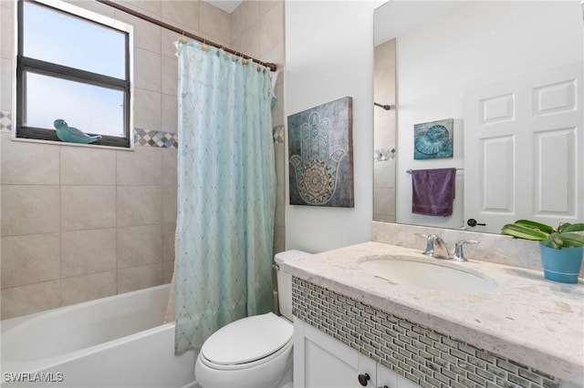 full bathroom featuring shower / tub combo, vanity, and toilet