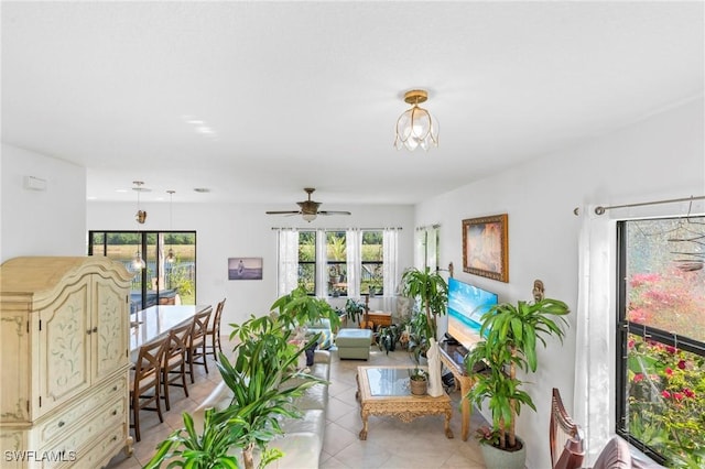 living room featuring ceiling fan and light tile patterned flooring