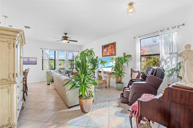 tiled living room featuring ceiling fan