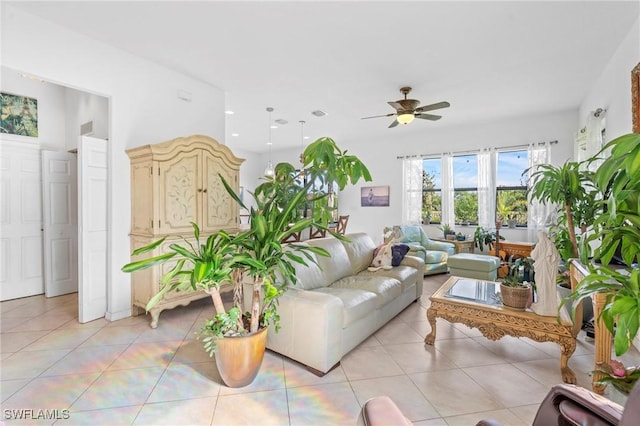 living room featuring ceiling fan and light tile patterned floors