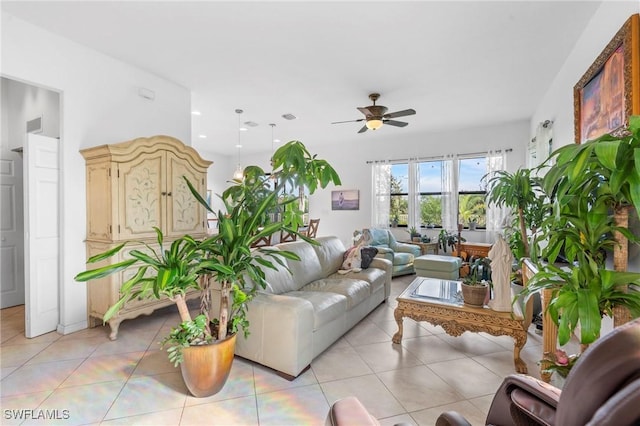 tiled living room featuring ceiling fan