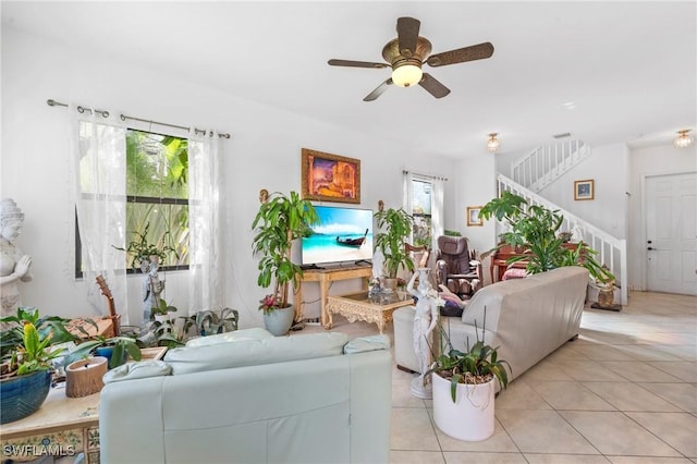 living room featuring ceiling fan, a healthy amount of sunlight, and light tile patterned flooring