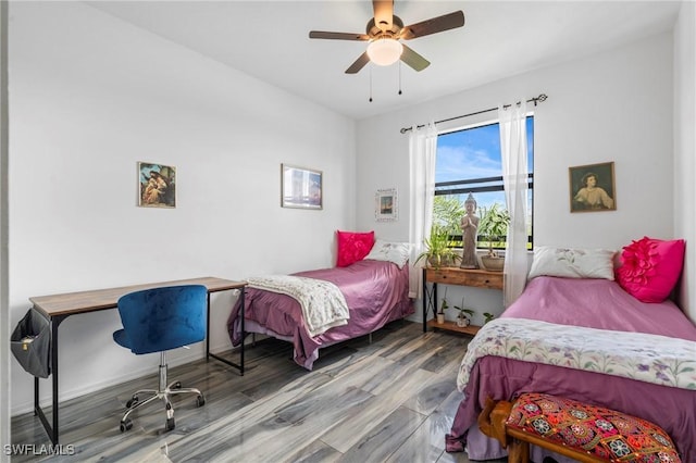 bedroom with hardwood / wood-style flooring and ceiling fan