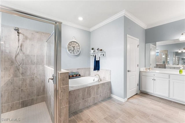 bathroom with vanity, independent shower and bath, and crown molding