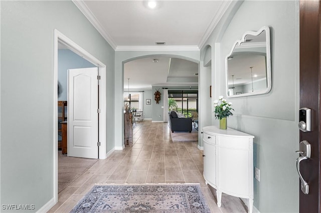 entryway featuring ornamental molding