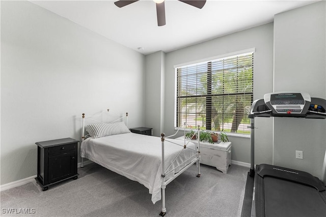 bedroom with carpet, ceiling fan, and multiple windows