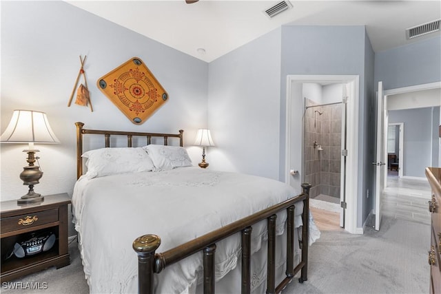 carpeted bedroom featuring ensuite bathroom and ceiling fan