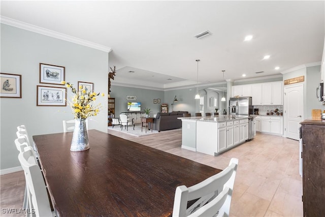 dining area with crown molding