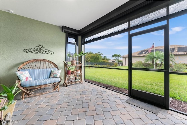 unfurnished sunroom featuring a healthy amount of sunlight