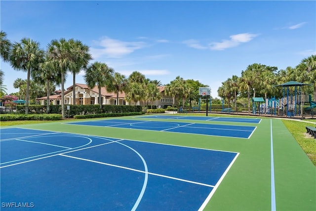 view of basketball court with a playground