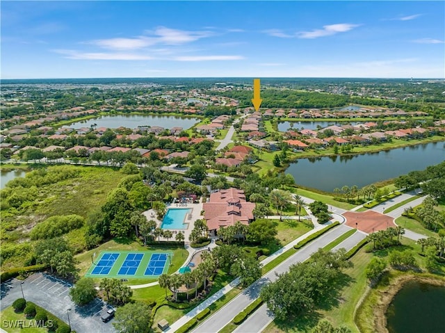 birds eye view of property with a water view