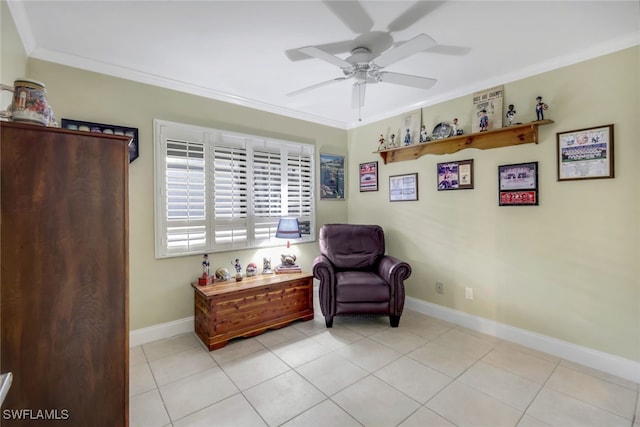 living area featuring crown molding, light tile patterned floors, baseboards, and ceiling fan