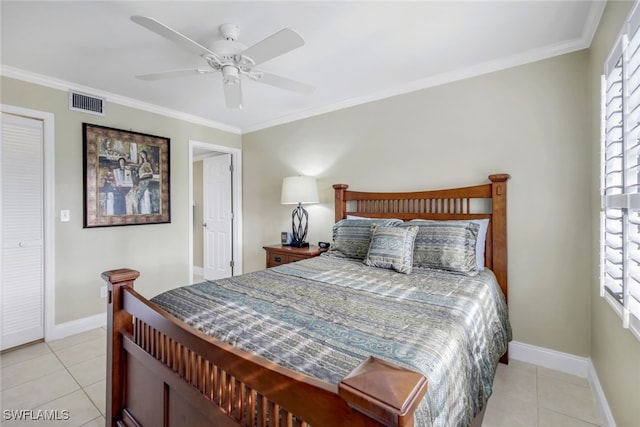 bedroom featuring multiple windows, light tile patterned flooring, and visible vents