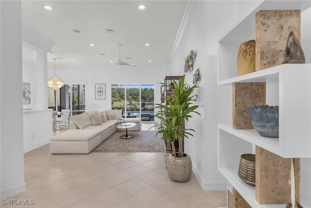 tiled living room featuring crown molding