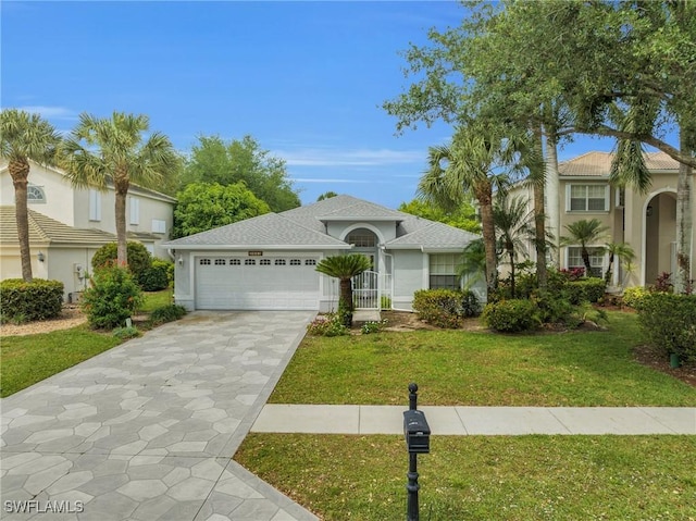 view of front of home with a garage and a front yard