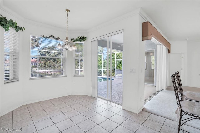 unfurnished dining area with crown molding, light tile patterned flooring, and a notable chandelier