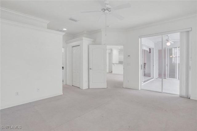 spare room featuring ceiling fan and ornamental molding