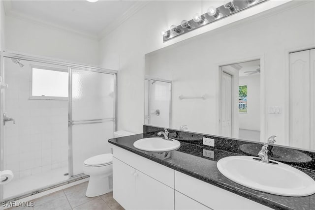 bathroom featuring crown molding, a shower with door, tile patterned flooring, vanity, and toilet