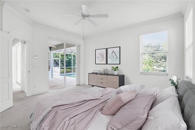 carpeted bedroom with multiple windows, access to exterior, ornamental molding, and ceiling fan