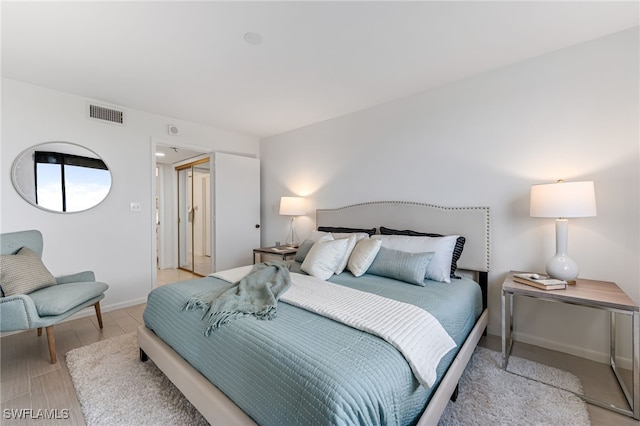 bedroom with light hardwood / wood-style flooring