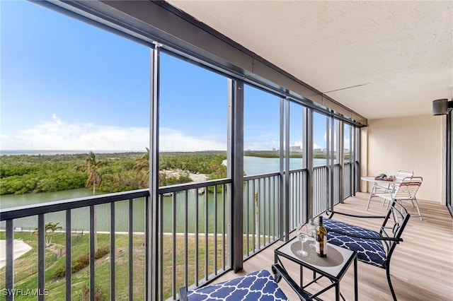 sunroom with a water view