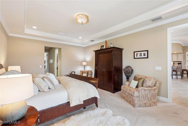 carpeted bedroom with a raised ceiling and ornamental molding