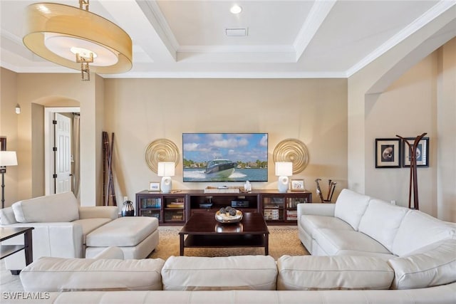 living room featuring a raised ceiling and crown molding