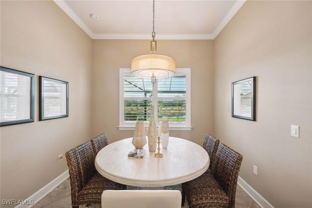 tiled dining area with a wealth of natural light and crown molding