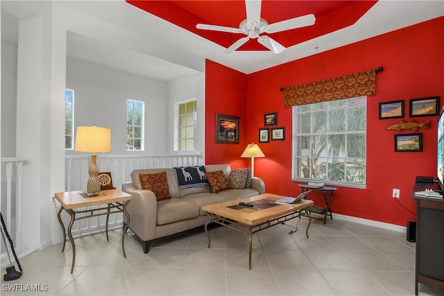 living room with plenty of natural light, ceiling fan, and light tile patterned floors