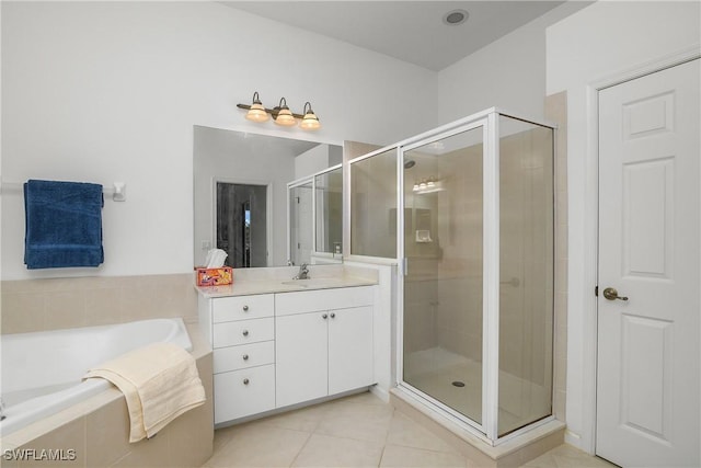 bathroom with tile patterned flooring, vanity, and independent shower and bath