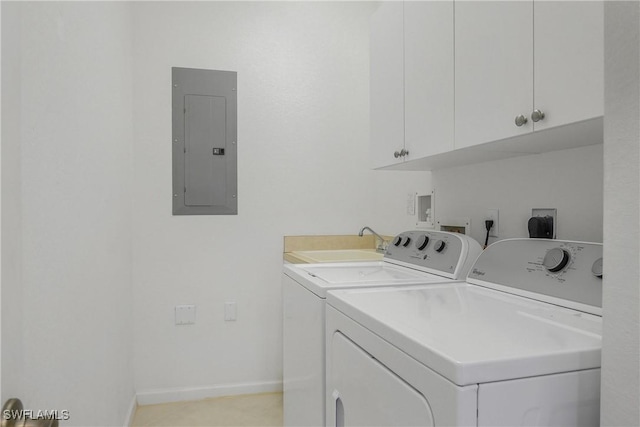 clothes washing area with cabinets, separate washer and dryer, sink, and electric panel