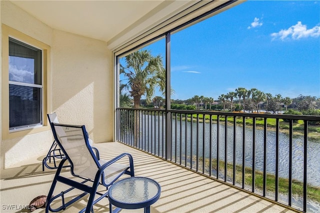 balcony featuring a water view