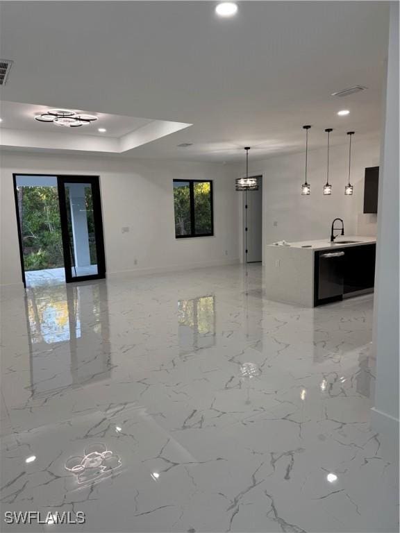 spare room with plenty of natural light and sink