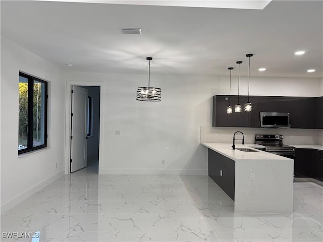 kitchen featuring decorative light fixtures, kitchen peninsula, sink, and black electric range