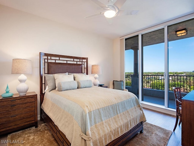 bedroom with hardwood / wood-style flooring, ceiling fan, floor to ceiling windows, and access to outside