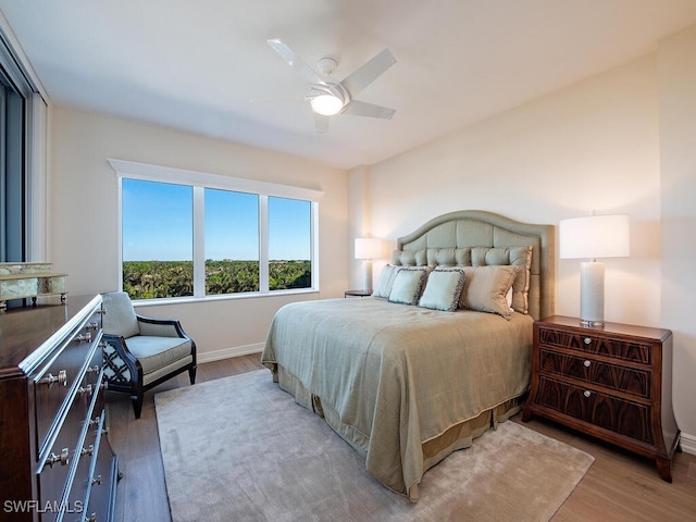 bedroom featuring ceiling fan and light hardwood / wood-style floors