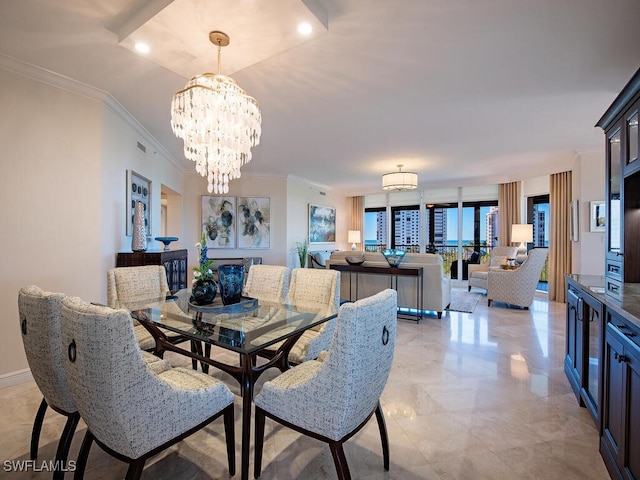 dining area featuring crown molding and an inviting chandelier