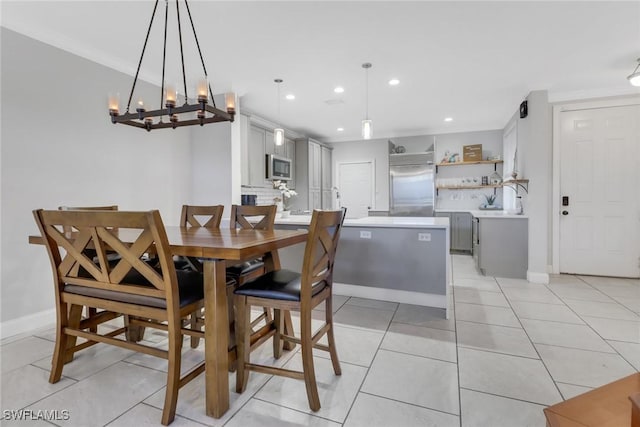 dining area featuring recessed lighting, baseboards, and light tile patterned floors