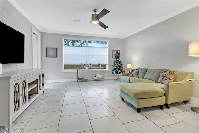 living room featuring light tile patterned floors, ornamental molding, a ceiling fan, and baseboards