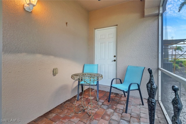 property entrance featuring stucco siding