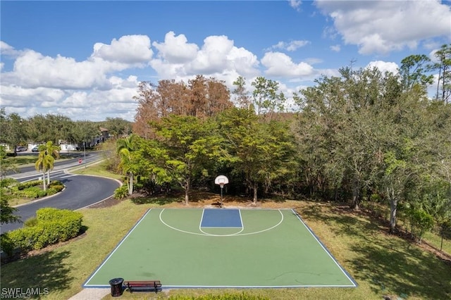 view of sport court featuring a yard and community basketball court