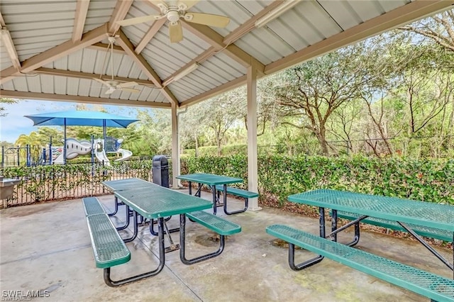 view of patio with a gazebo, outdoor dining area, fence, and a ceiling fan