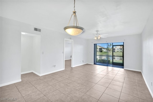 unfurnished room featuring light tile patterned floors and ceiling fan